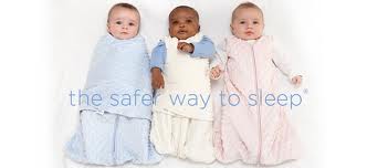 Photo of three swaddled babies