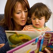 Woman with child reading a book