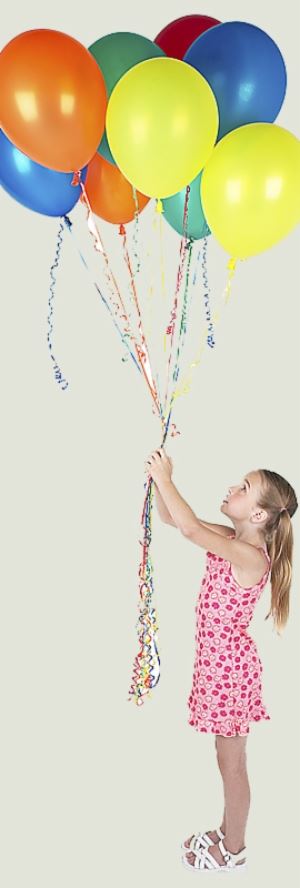 Girl staring up at balloons