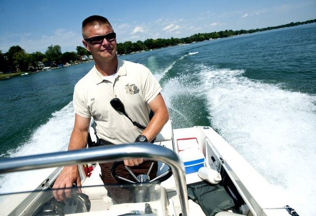 Deputy Driving A Boat on a Lake